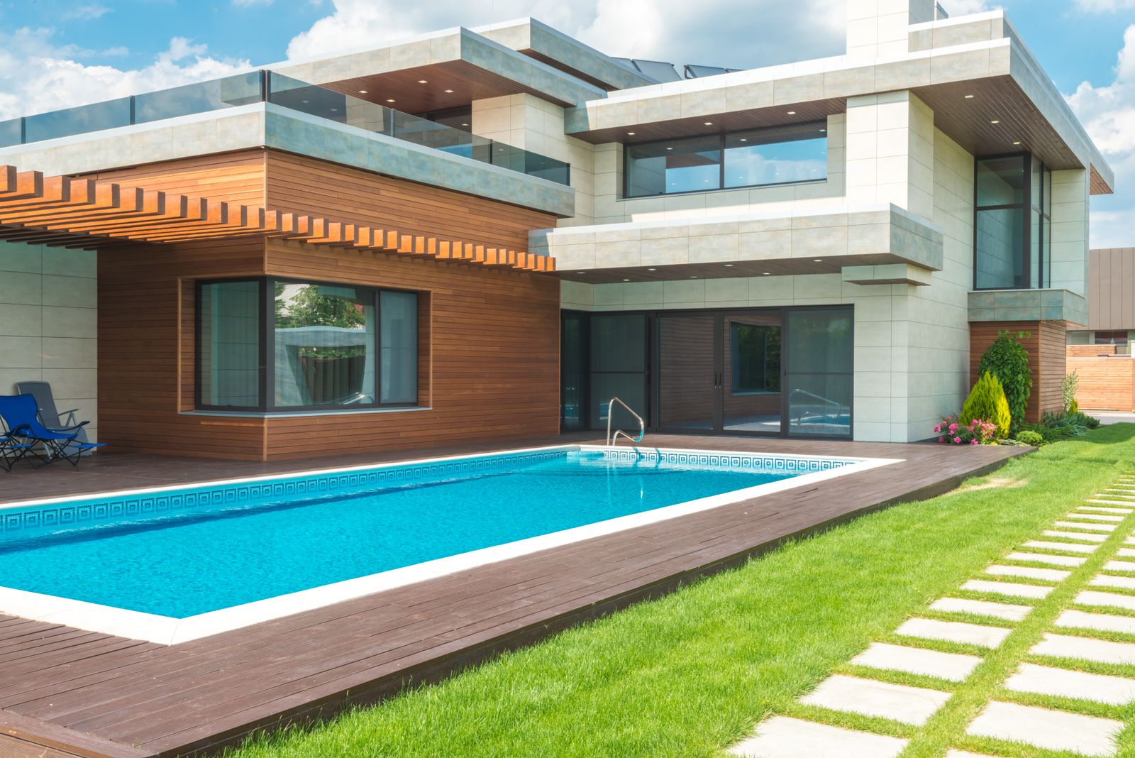 A contemporary luxury home surrounded by greenery
